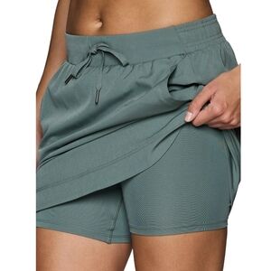 RBX Stretch Woven Skort With Front Pockets And Rounded Tulip Hem